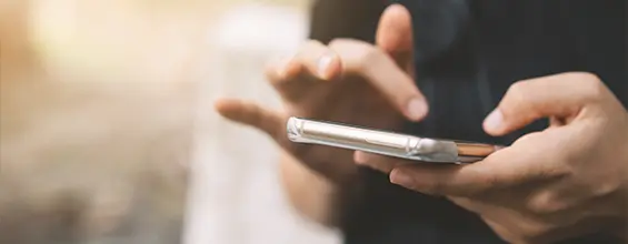 Person using mobile device.